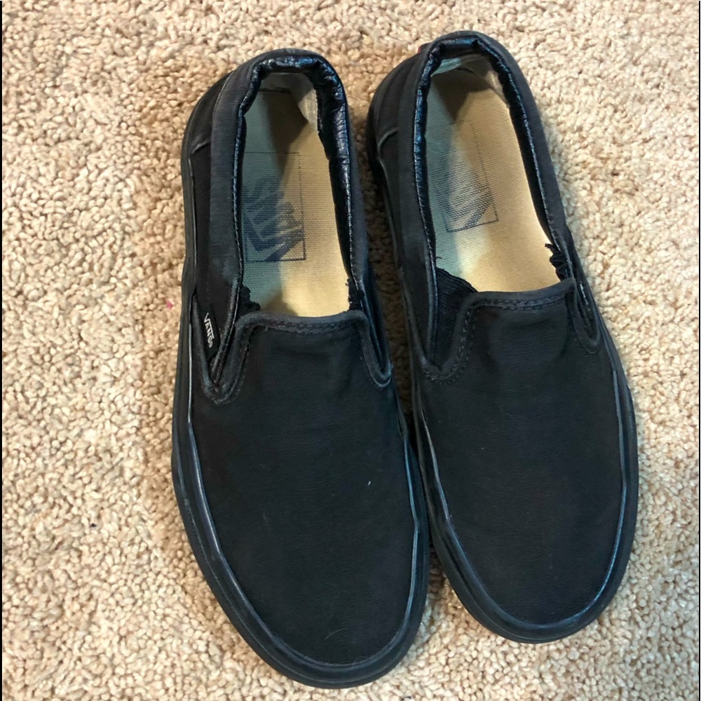 All black slip on vans
